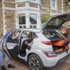 Family getting into an electric vehicle